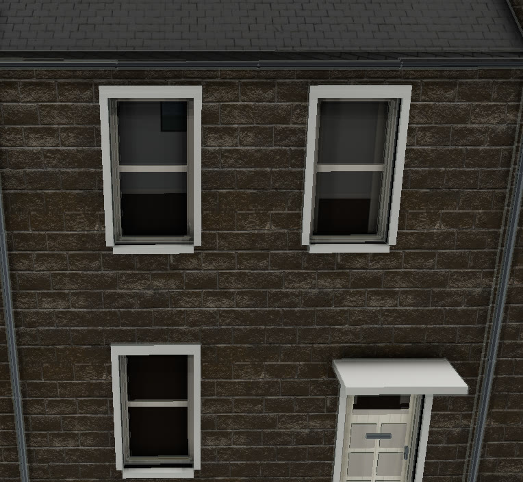Close-up of stone masonry in VeriStreet with deep mortar joints, white window frames and furnished rooms behind the glass.