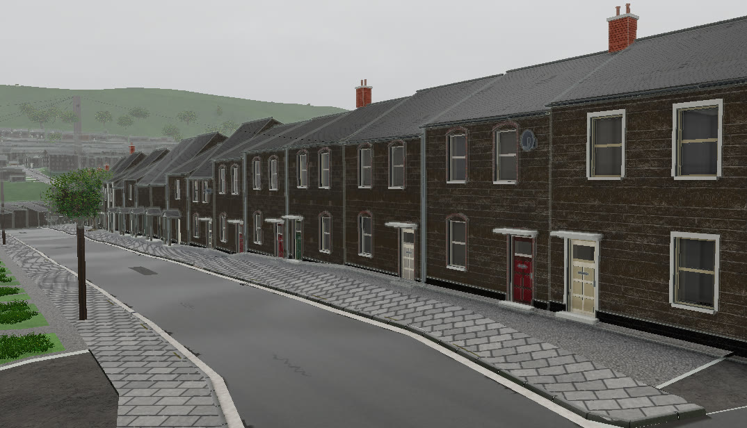 A Pontypridd street in VeriStreet running towards green hills, with paved footways, kerbs and a telegraph pole.